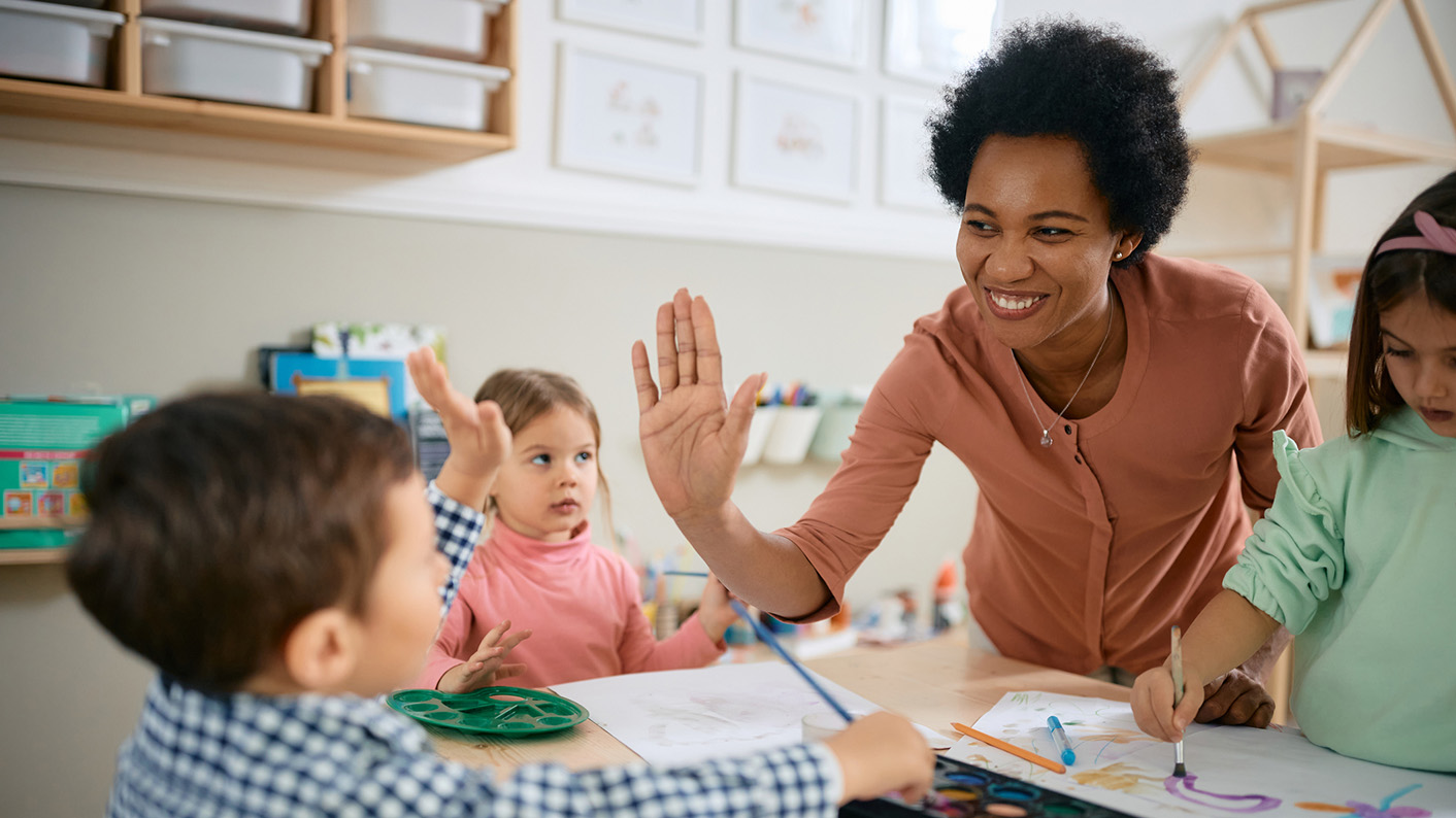 SEN teacher supporting pupils in class